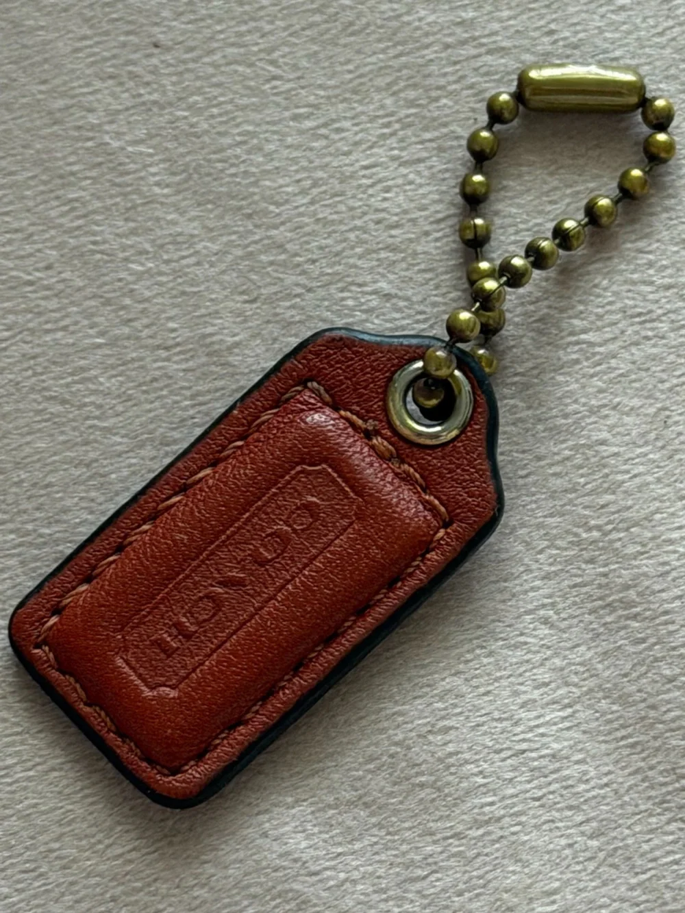 COACH Small Orange Leather Hangtag🧡